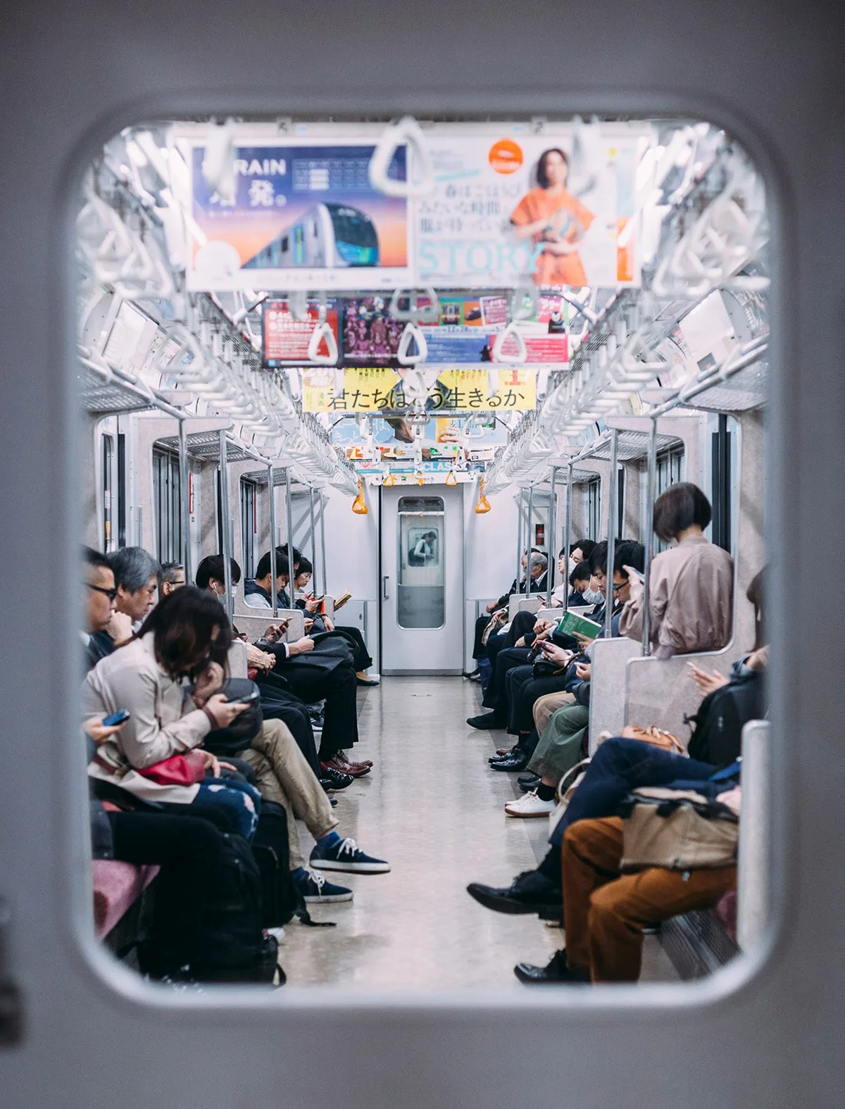 A commuter train in Japan, seen through a carriage door